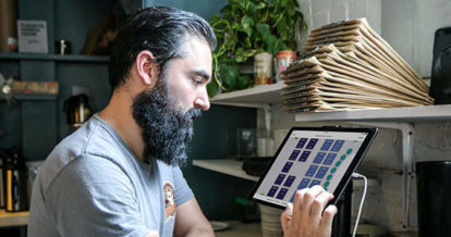 restaurant owner using iPad